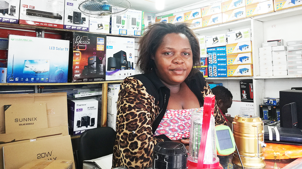 Agnes at her solar shop in downton Dar Es Salaam